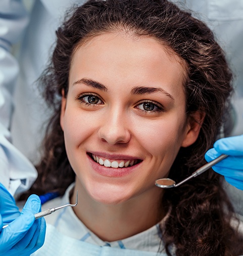 young woman getting a dental exam