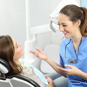 woman talking to her dental implant dentist in Merrimack 
