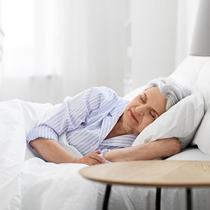 Woman asleep with dental implants