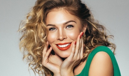 woman with red lipstick smiling