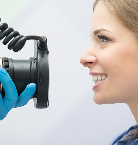 Dentist taking digital photos