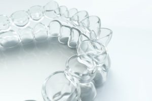 Closeup of an Invisalign clear aligner.
